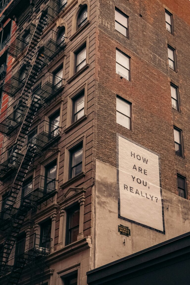 Brick building with white sign on it